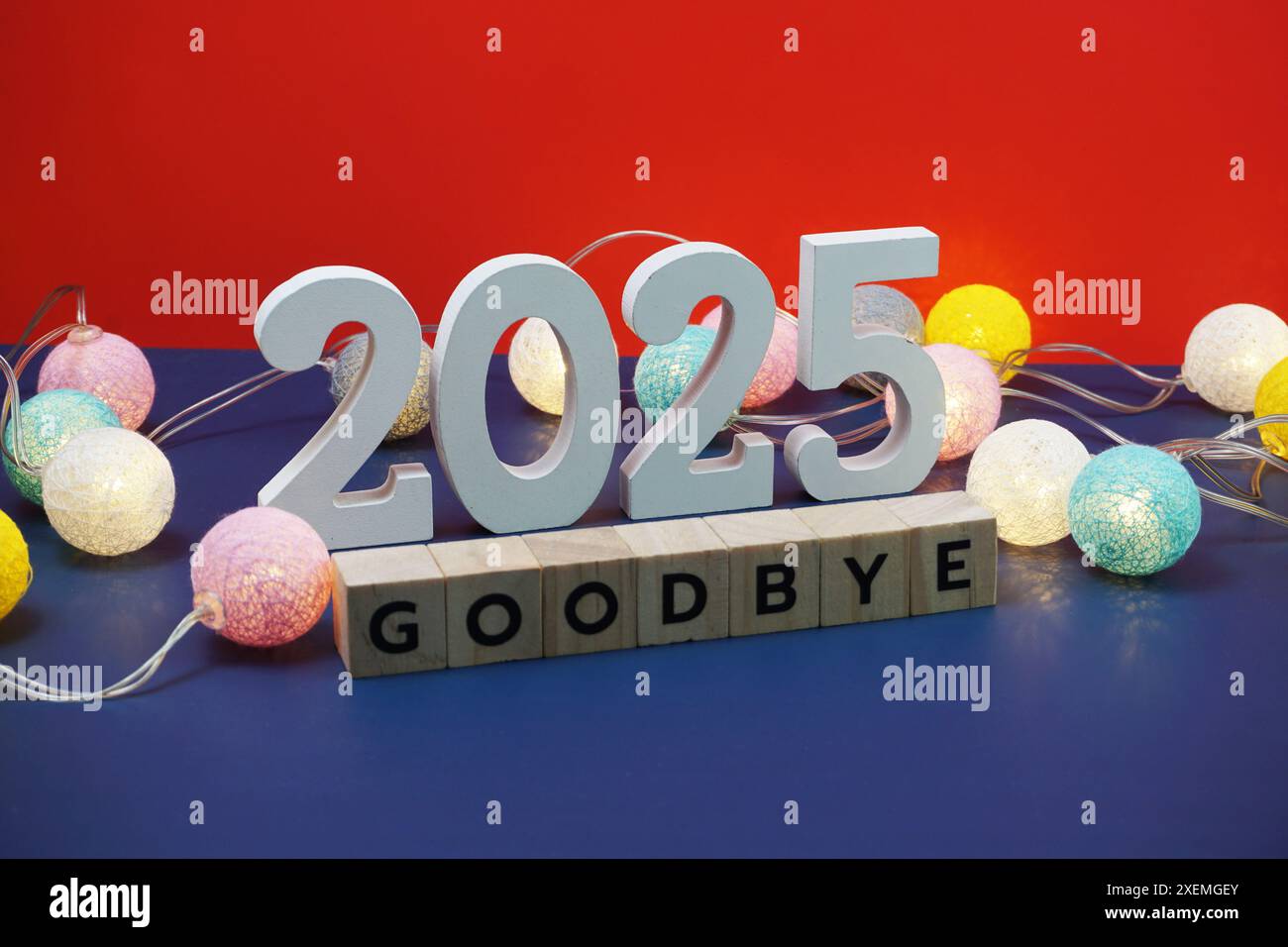 Goodbye 2025 word alphabet letters on red and blue background Stock