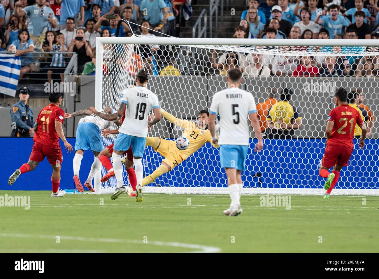 Mathias Olivera of Uruguay (16) shoots on goal during group stage game