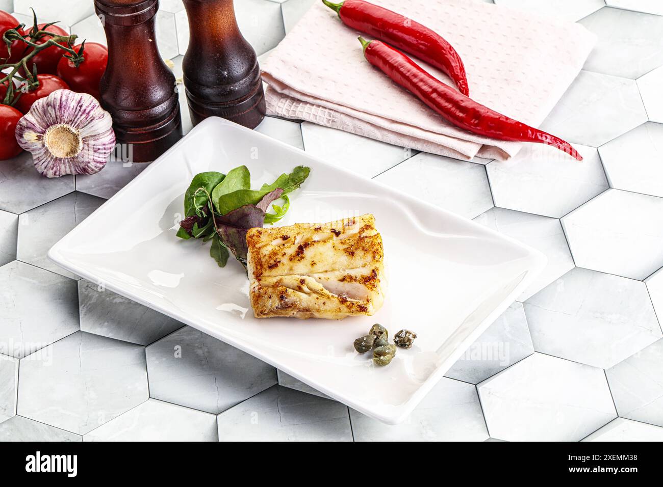 Roasted cod fish steak with salad leaves Stock Photo - Alamy