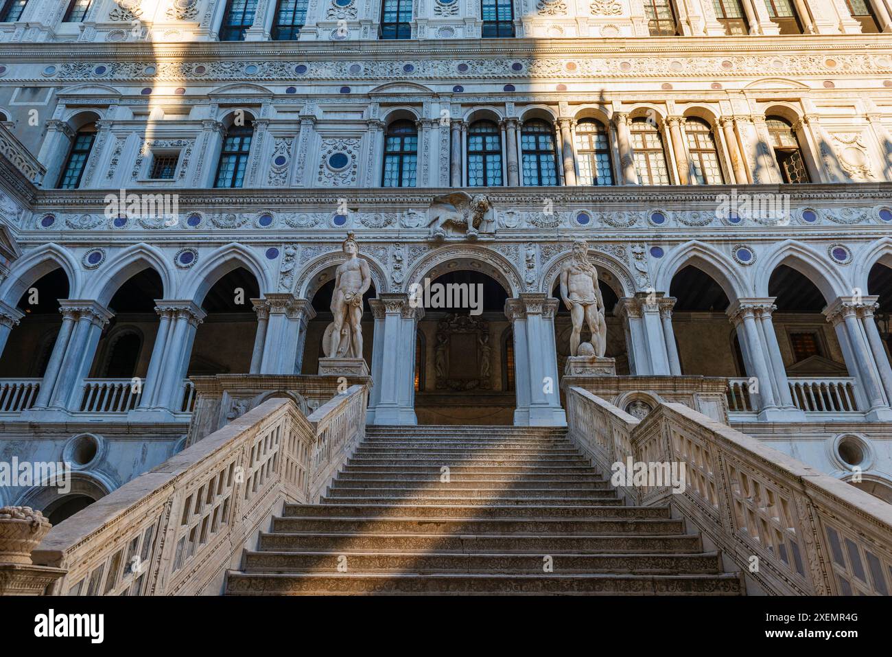 View of the Giant's Staircase (Scala dei Giganti) with marble statues of Mars and Neptune by Sansovino at Doge's Palace (Palazzo Ducale) in Venice Stock Photo