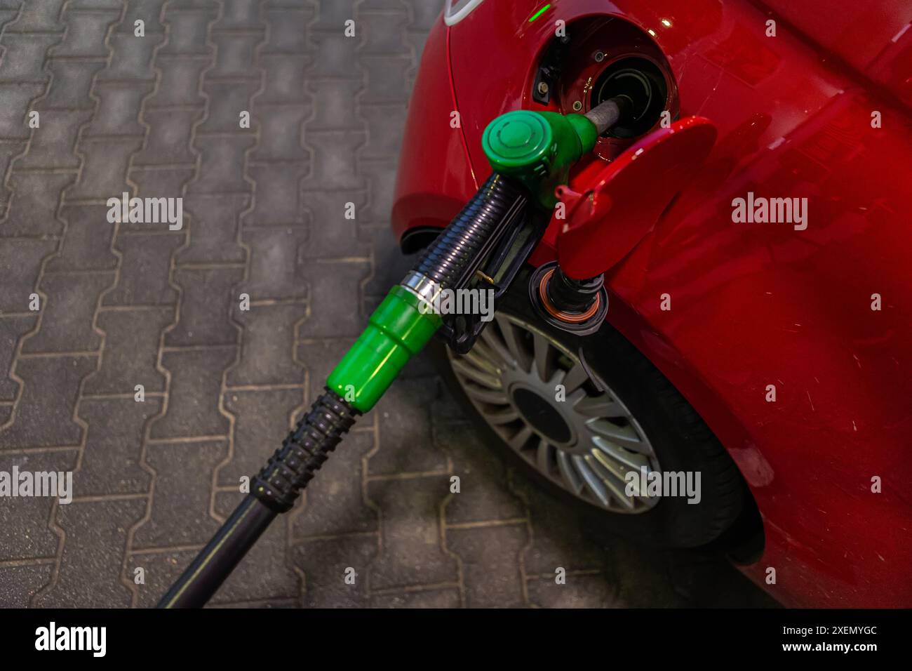Filling the car with gasoline at gas station Stock Photo - Alamy