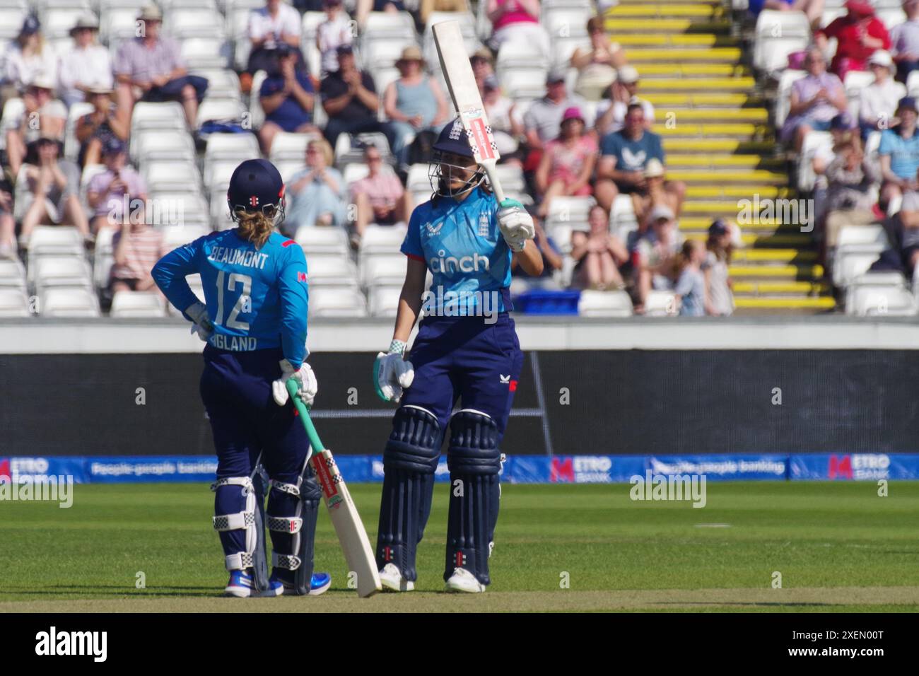 Chester le Street, 26 June 2024. Maia Bouchier raising her bat after scoring a half century for England against New Zealand in the First Metro Bank One Day International at Seat Unique Riverside. Credit: Colin Edwards Stock Photo