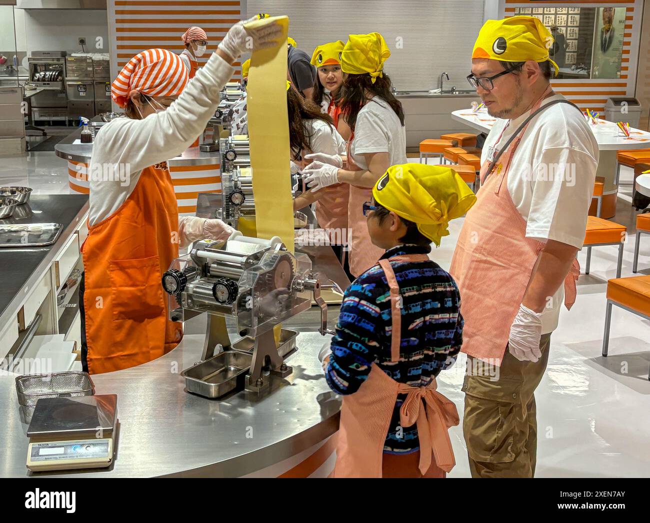 Visitors seen learning about the production process of instant noodles