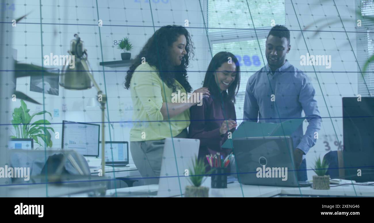 A digitally generated image of numbers processing over a grid on a screen with squares Stock Photo