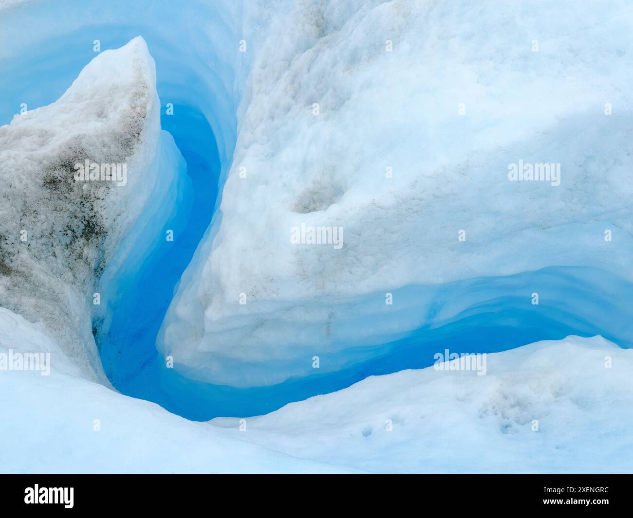 Drainage system on the surface of the ice sheet. The brown sediment on ...