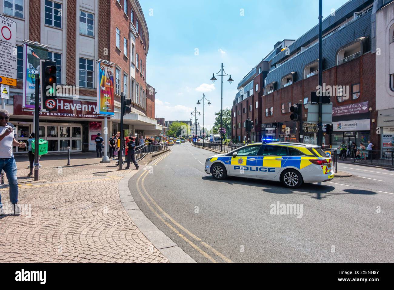 Part of the ringroad in StainesuponThames is closed with a police car