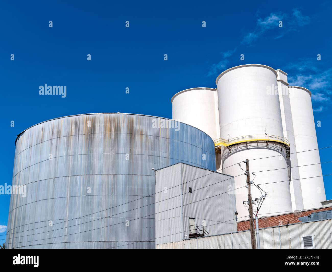 Tops of industrial storage tanks at a food processing facility Stock Photo