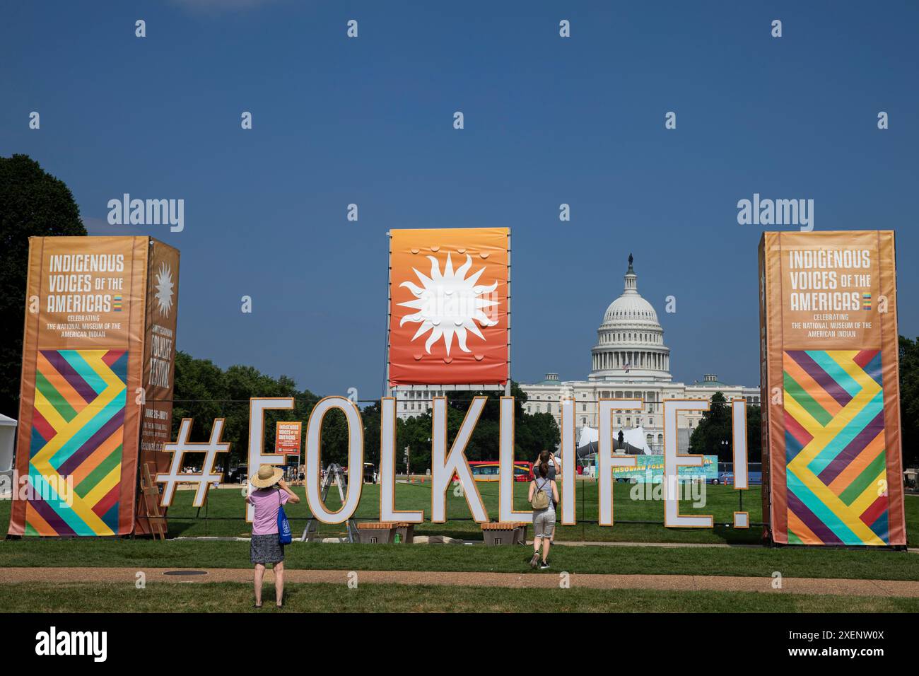 A large sign of the Smithsonian Folklife Festival is seen on the National Mall during the