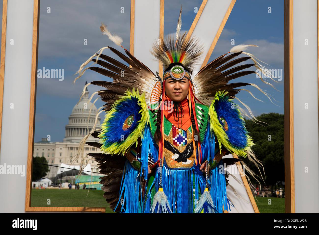 An indigenous performer poses for photographs during the Smithsonian