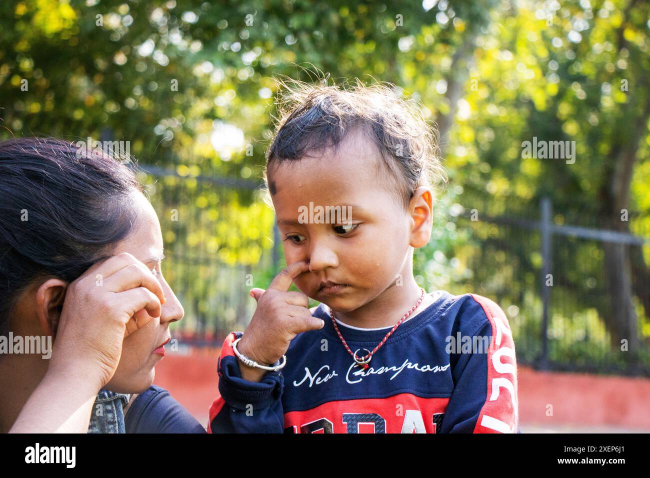 Indian kid playing in the outdoor park Stock Photo