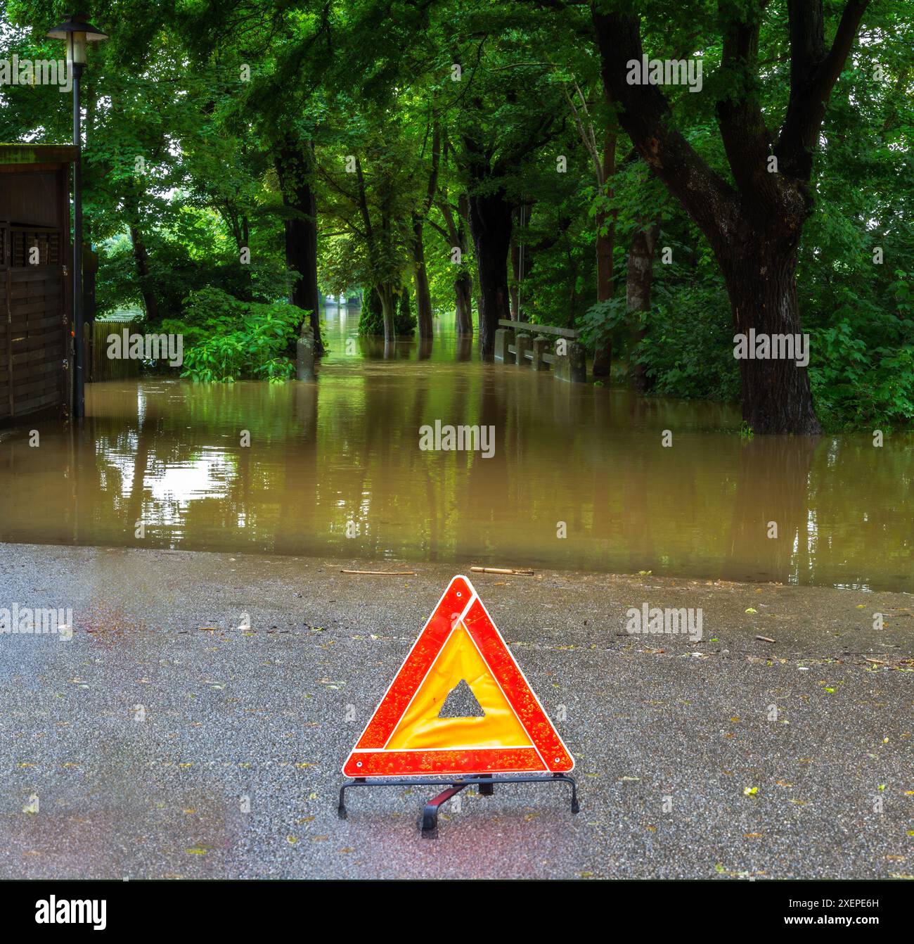 Warning sign at a flooded street in Schrobenhausen Stock Photo - Alamy