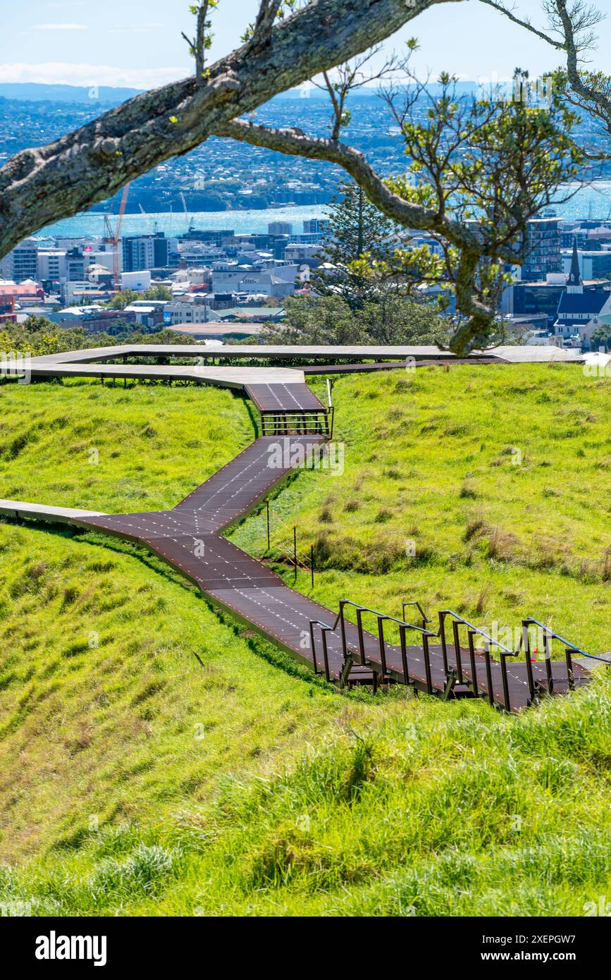 A walkway and viewing platform at the summit of the dish shaped crater at the centre of the Mt Eden (Maungawhau) Scoria Cone mound in Auckland NZ Stock Photo