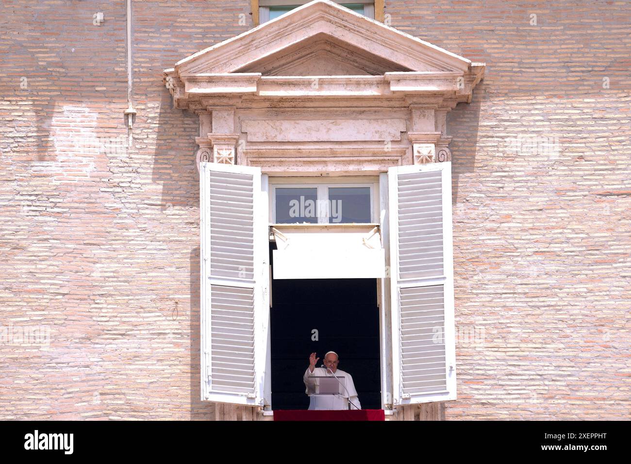 Pope Francis appears at the window of his studio to say the Sunday ...