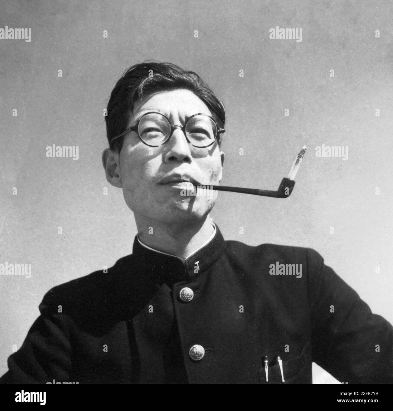 Japanese man with cigarette holder Stock Photo
