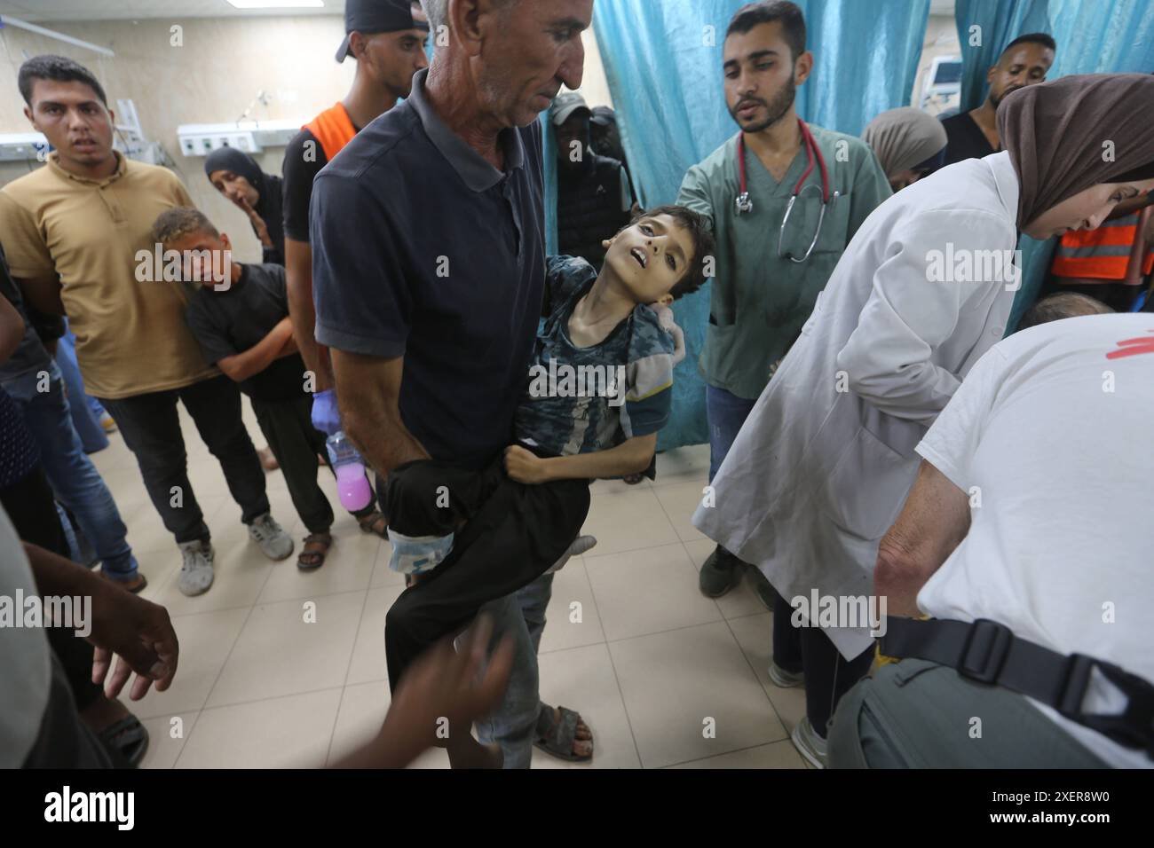 Relatives of the Palestinians died in Israeli attacks, mourn as they ...