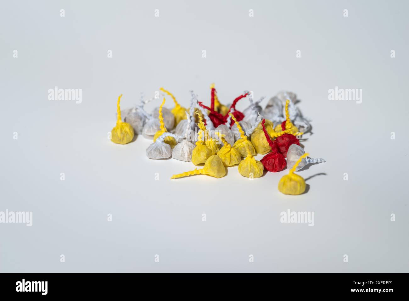 Small bang snaps,Pop Pop Snappers,toy torpedo, jumpin cracker or noisemaker firework for children, white background Stock Photo