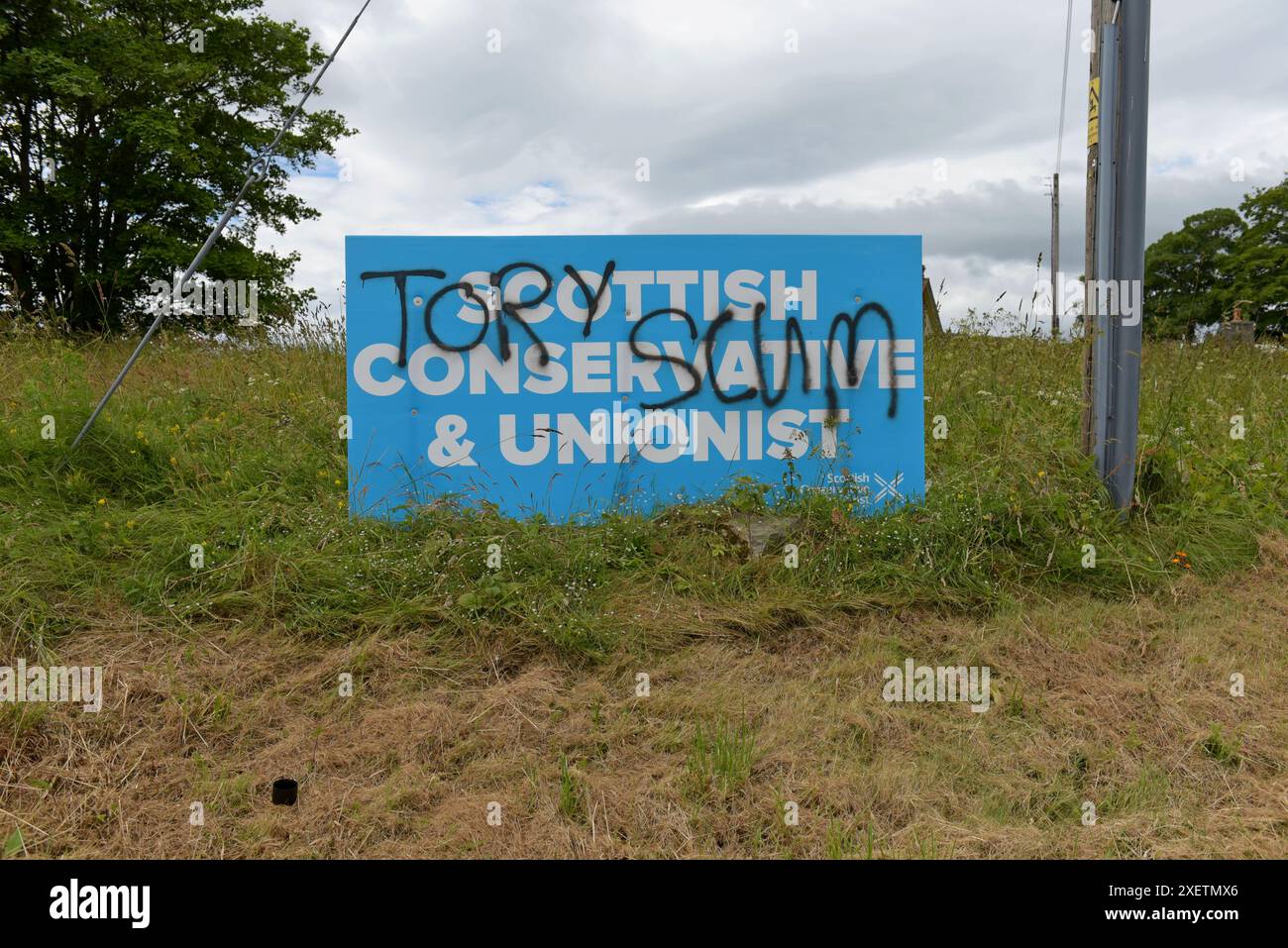 Millbank, Aberdeen, Scotland, 29th June 2024. A defaced Scottish Conservative Party election banner spraypainted with the words 'Tory Scum' at Millbank, near Ordhead, Aberdeen. G.P. Essex/Alamy Live News Stock Photo