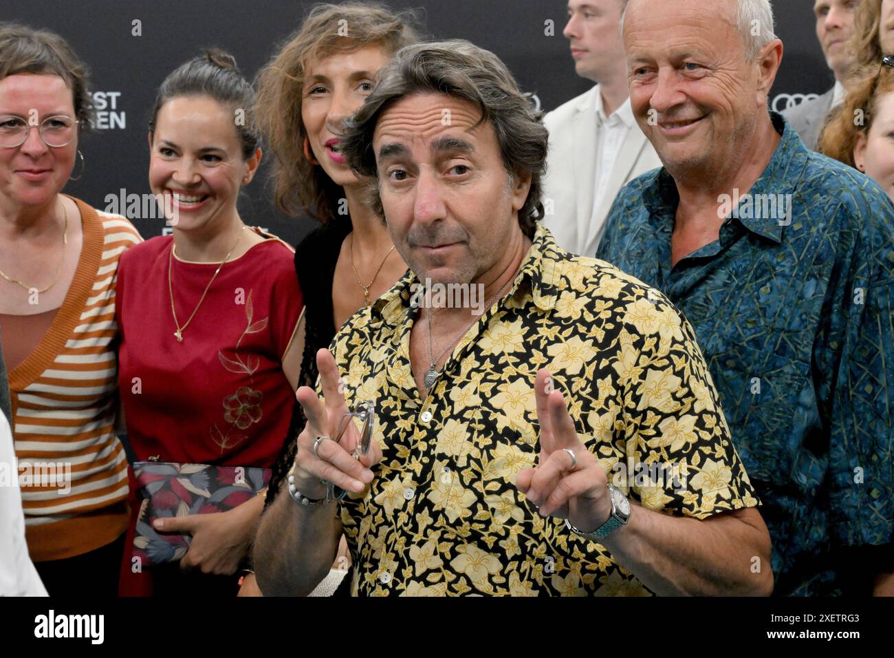 Munich, Germany. 29th June, 2024. Actor Dieter Landuris walks down the turquoise carpet to the opening gala with the world premiere of the comedy 'Zwei zu eins' at the Isarphilharmonie in HP8 as part of the Munich Film Festival. Credit: Felix Hörhager/dpa/Alamy Live News Stock Photo