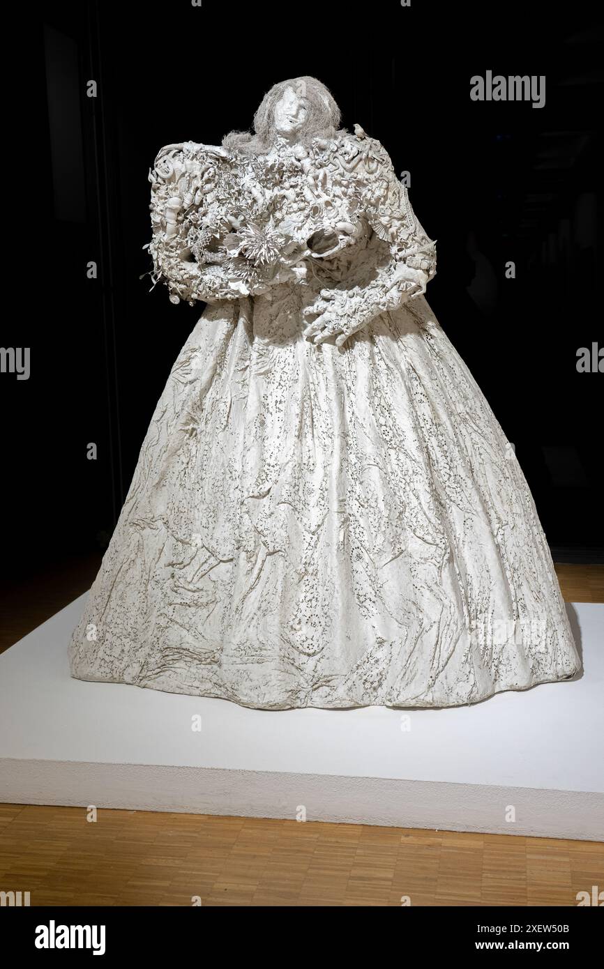 Representation of a bride in a white dress with a horrific appearance on a black background.Paris-France Stock Photo