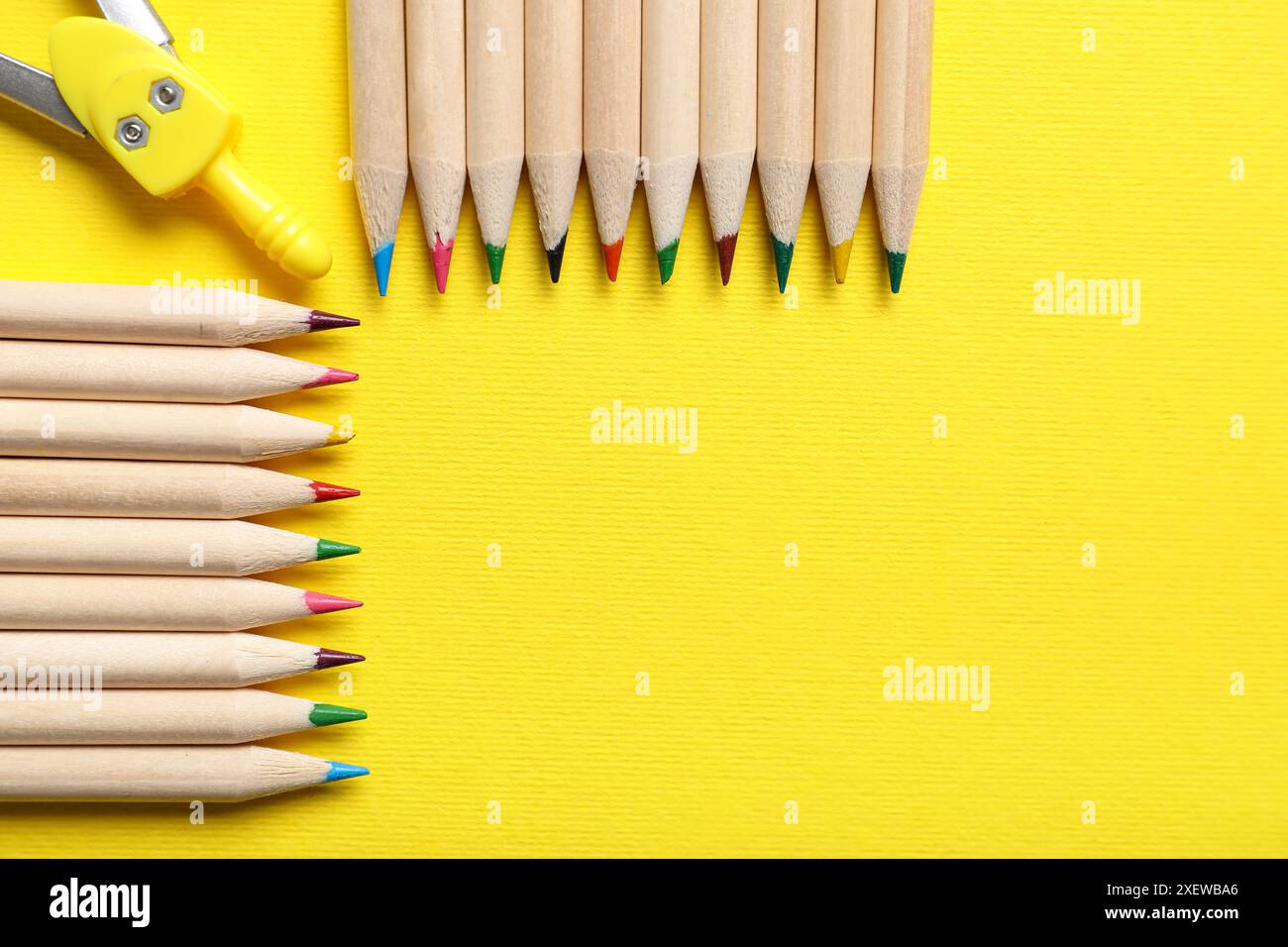 Pencils and compass on yellow background, closeup Stock Photo