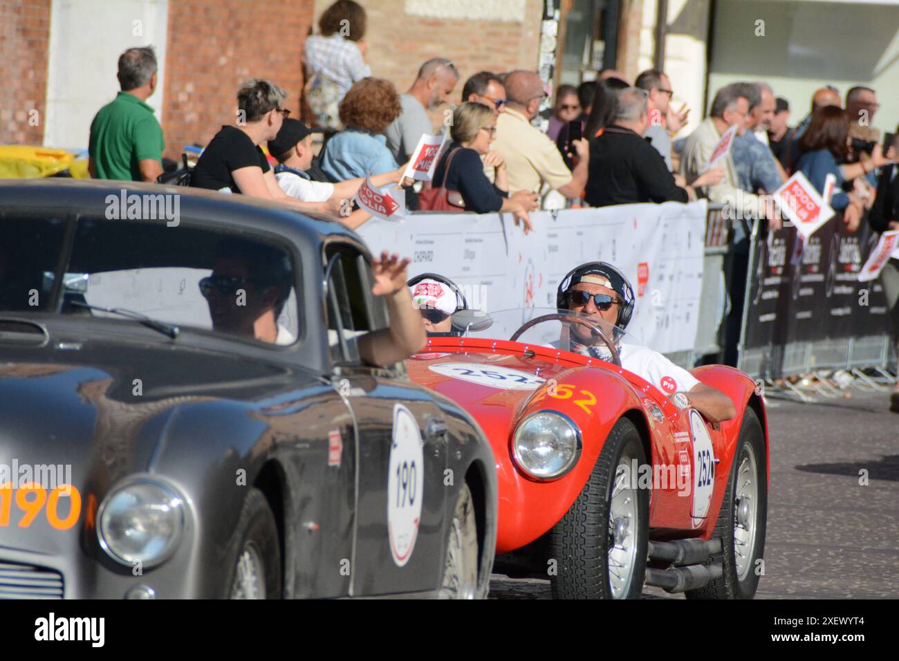 FERRARA , ITALY - jun 15 -2024 : A classic car races through the