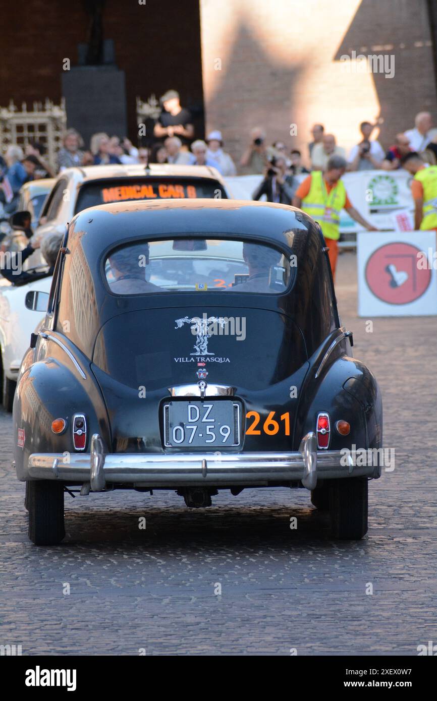 FERRARA , ITALY - jun 15 -2024 : A classic car races through the