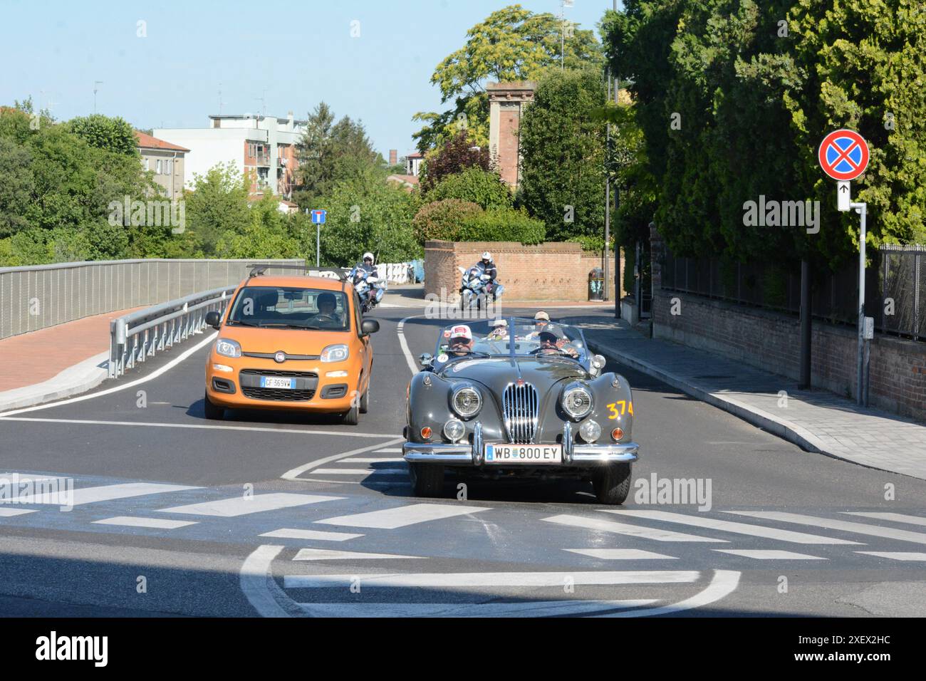 FERRARA , ITALY - jun 15 -2024 : A classic car races through the