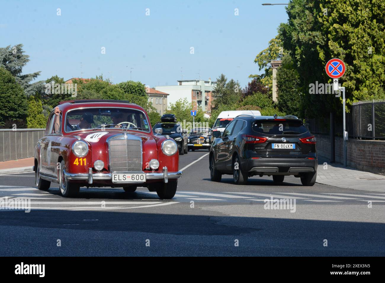 FERRARA , ITALY - jun 15 -2024 : A classic car races through the