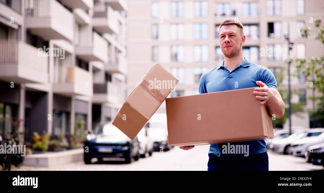 Young delivery man dropping hi-res stock photography and images - Alamy