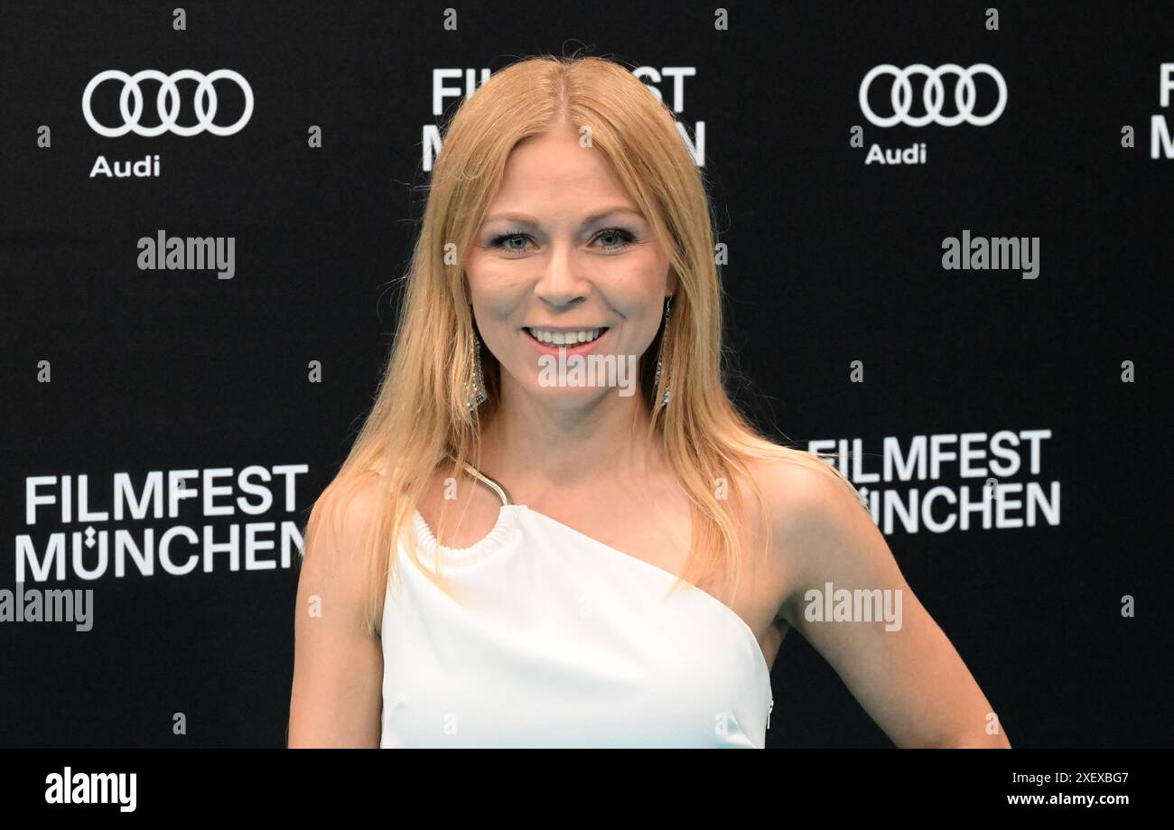 Munich, Germany. 29th June, 2024. Actress Anna Ewelina walks the carpet at the opening gala with the world premiere of the comedy 'Zwei zu eins' at the Isarphilharmonie in HP8 as part of the Munich Film Festival. Credit: Felix Hörhager/dpa/Alamy Live News Stock Photo