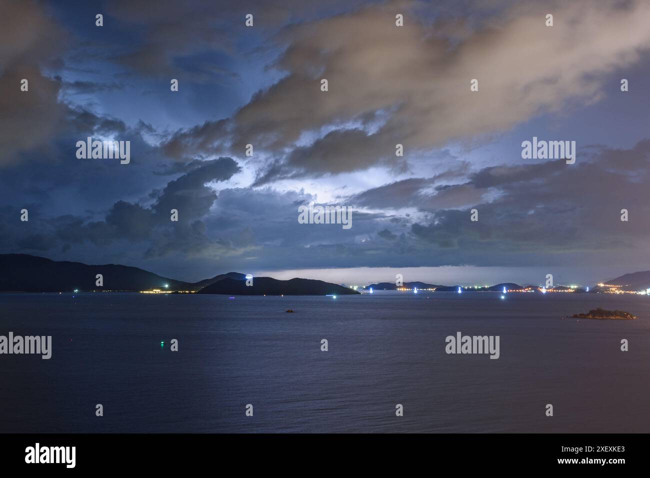 Dramatic dark stormy sky and lightning over Nha Trang Bay of South ...
