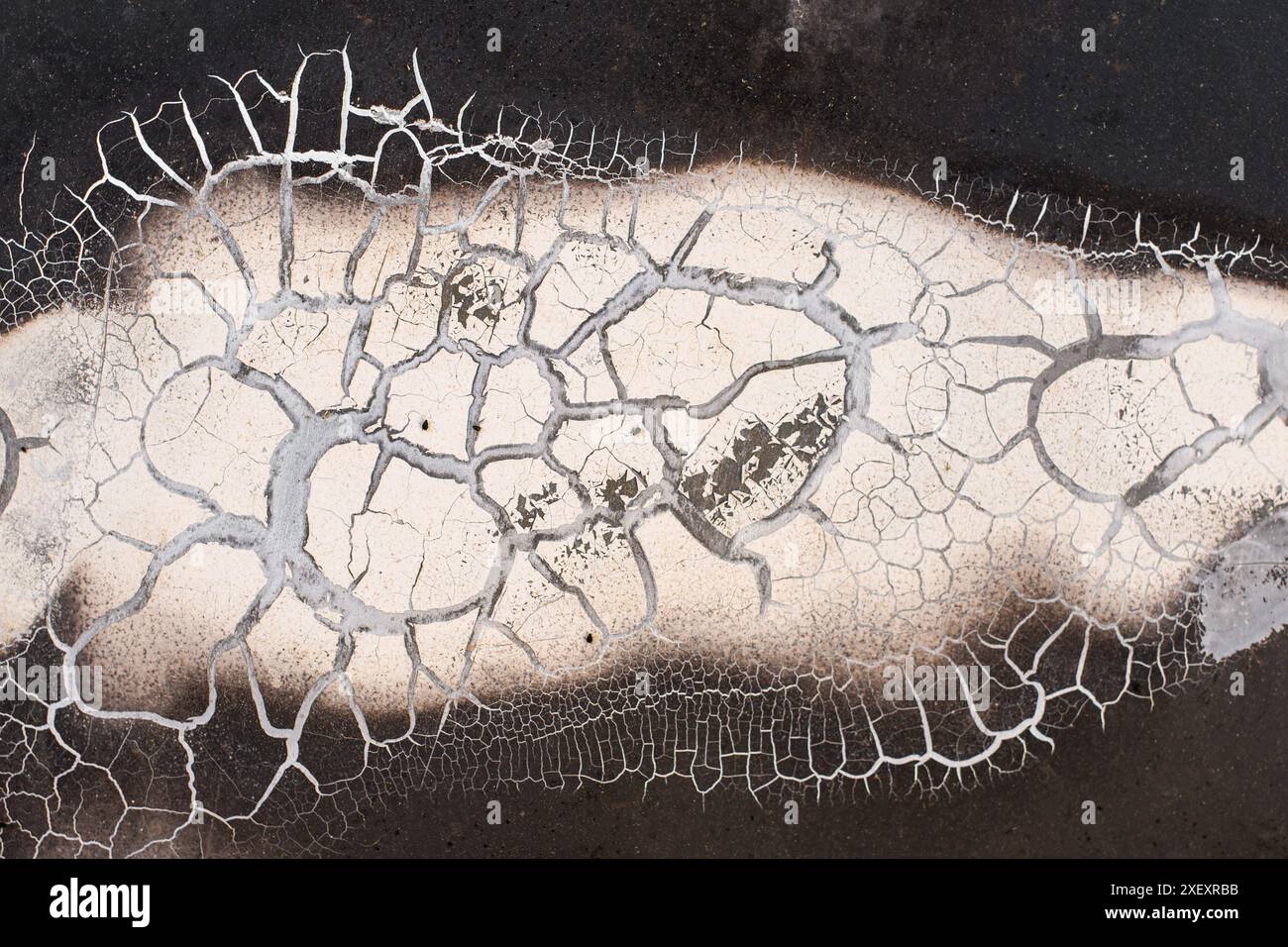 A detailed shot of a texture of cracked paint on an old steel sheet Stock Photo