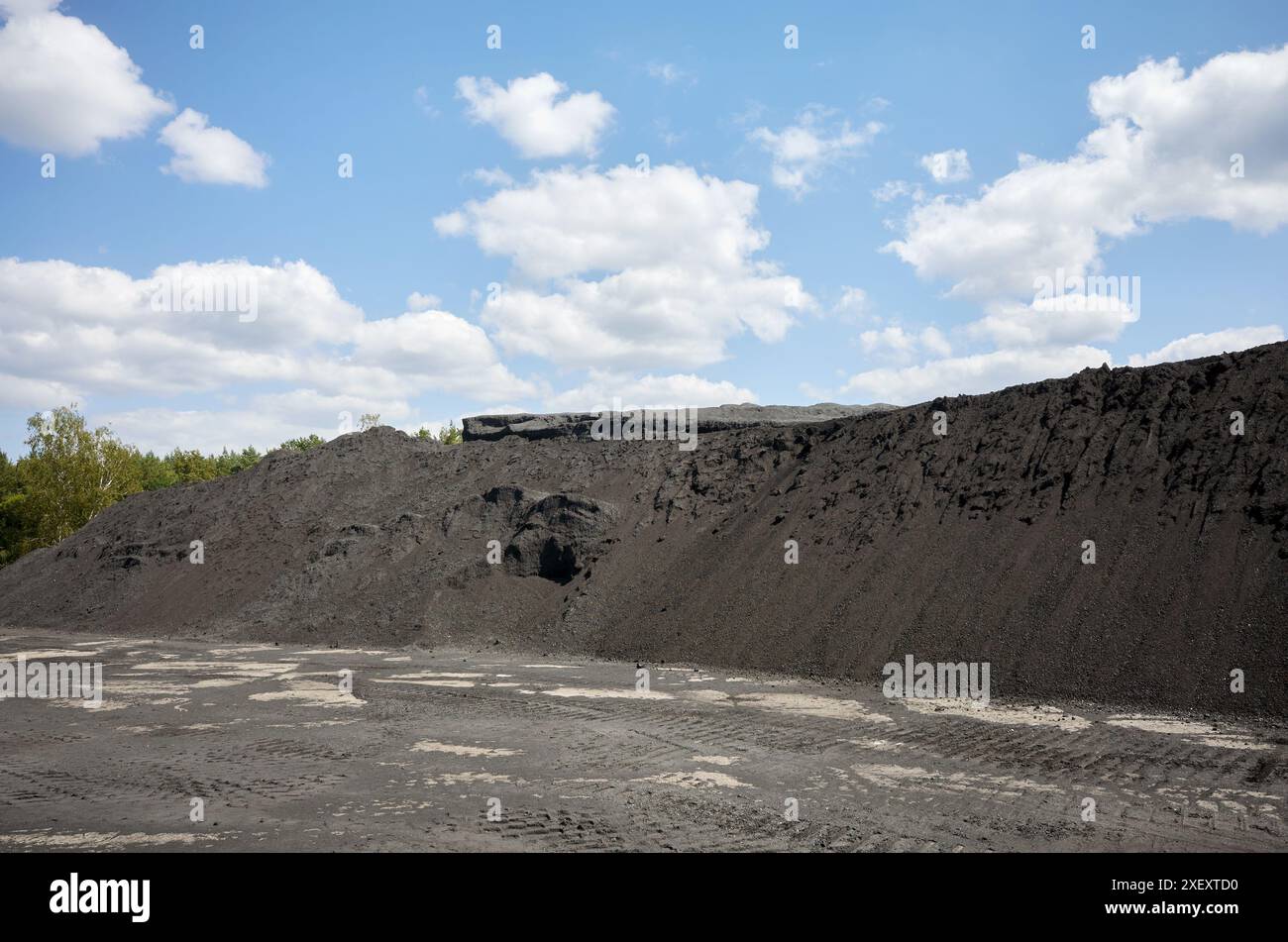 Coal heap against the sky. Stock Photo