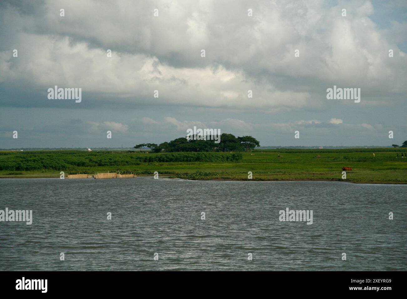 Black clouds over the head of a village at shariyatpur on the bank of Meghna River, Bangladesh. July 7, 2007 Stock Photo