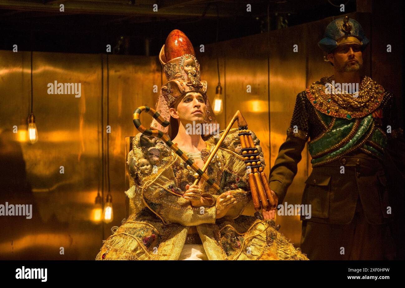 Coronation of Akhnaten, the new Pharaoh: Anthony Roth Costanzo (Akhnaten) in AKHNATEN by Philip Glass at English National Opera (ENO), London Coliseum WC2  04/03/2016  in association with Improbable  a co-production with LA Opera  conductor: Karen Kamensek  set design: Tom Pye  costumes: Kevin Pollard  lighting: Bruno Poet  skills ensemble choreography: Sean Gandini  director: Phelim McDermott Stock Photo