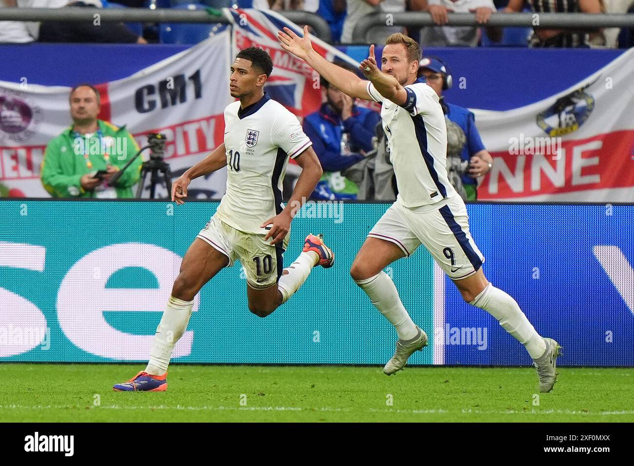 England's Jude Bellingham celebrates with Harry Kane after scoring
