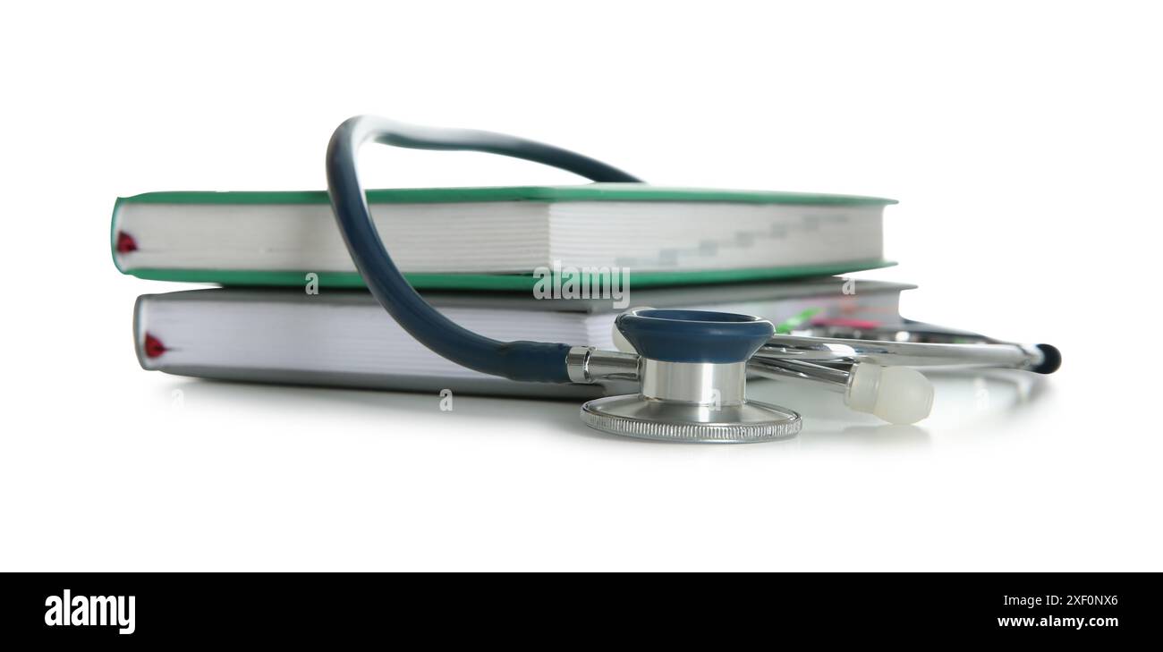 Stethoscope and stack of books isolated on white Stock Photo - Alamy