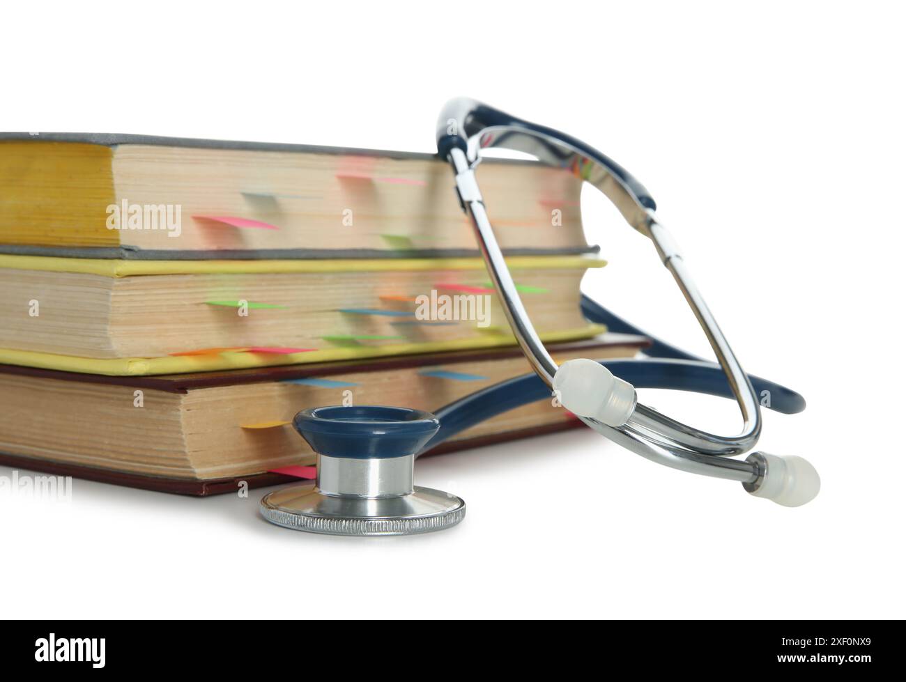 Stethoscope and stack of books isolated on white Stock Photo - Alamy