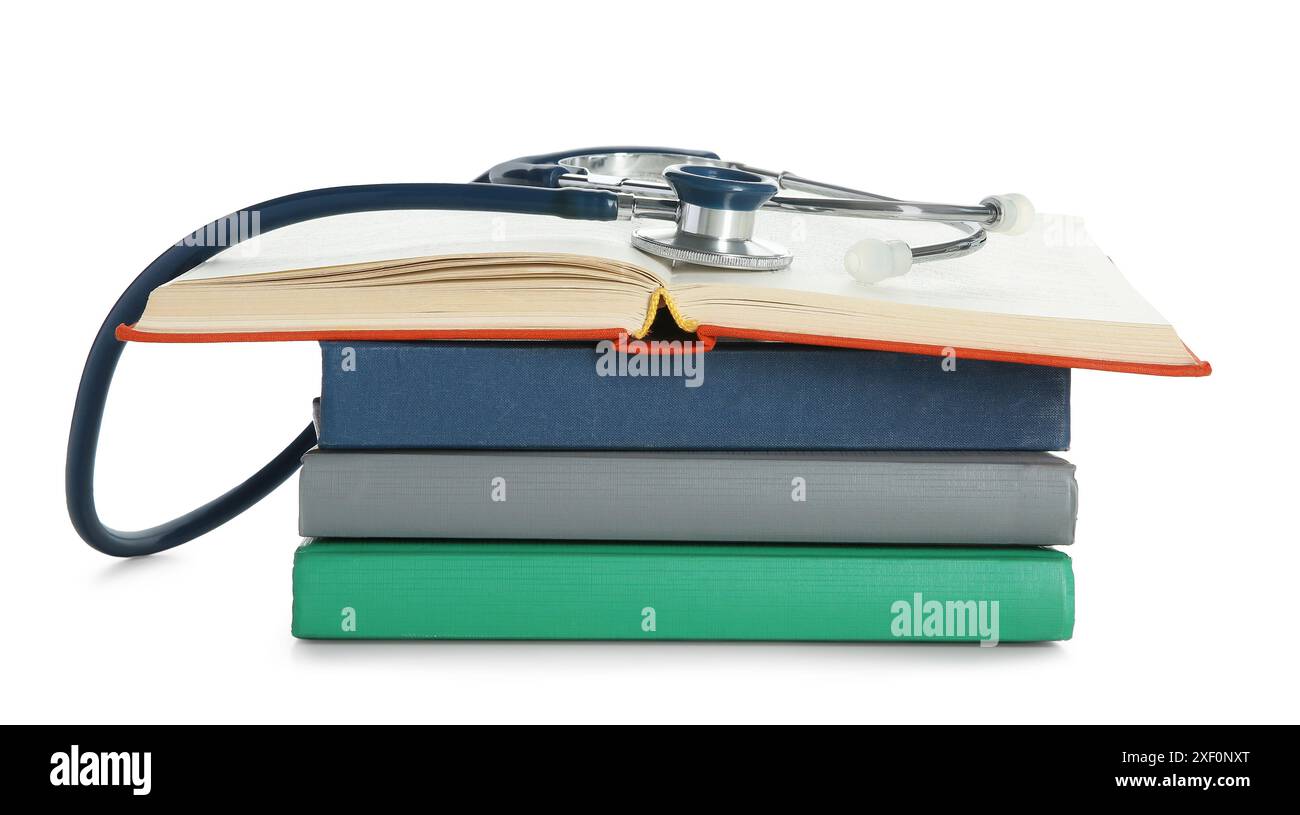 Stethoscope on stack of books against white background Stock Photo - Alamy