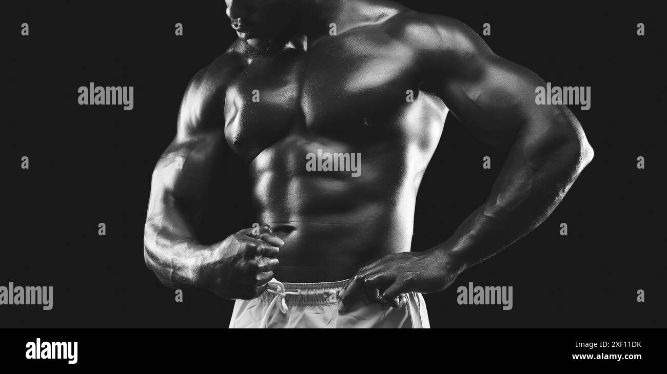 Muscular Man Posing in Black and White Stock Photo - Alamy