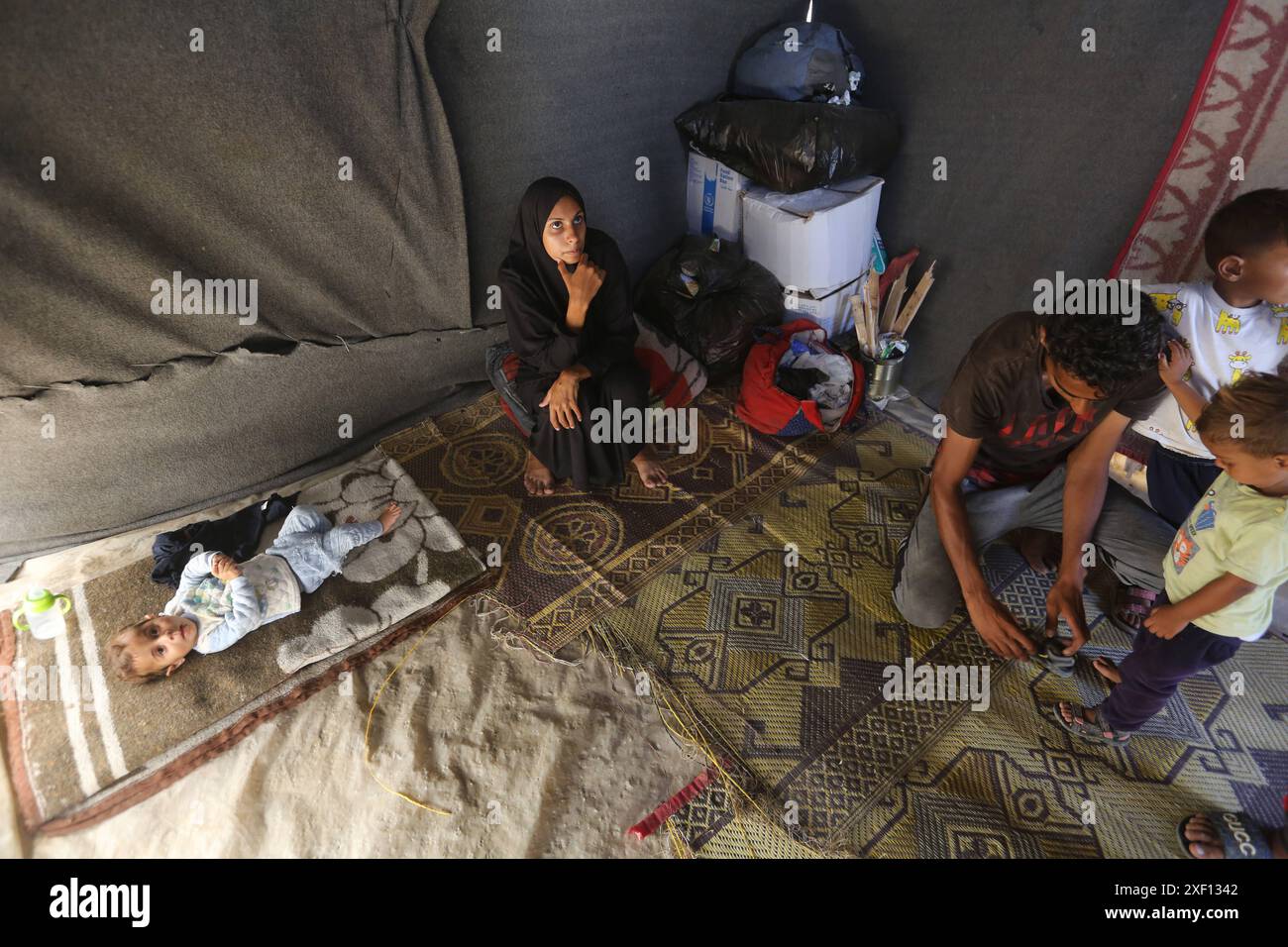 Noura Abu Al-Saud, a displaced Palestinian, lives in a tent inside a ...