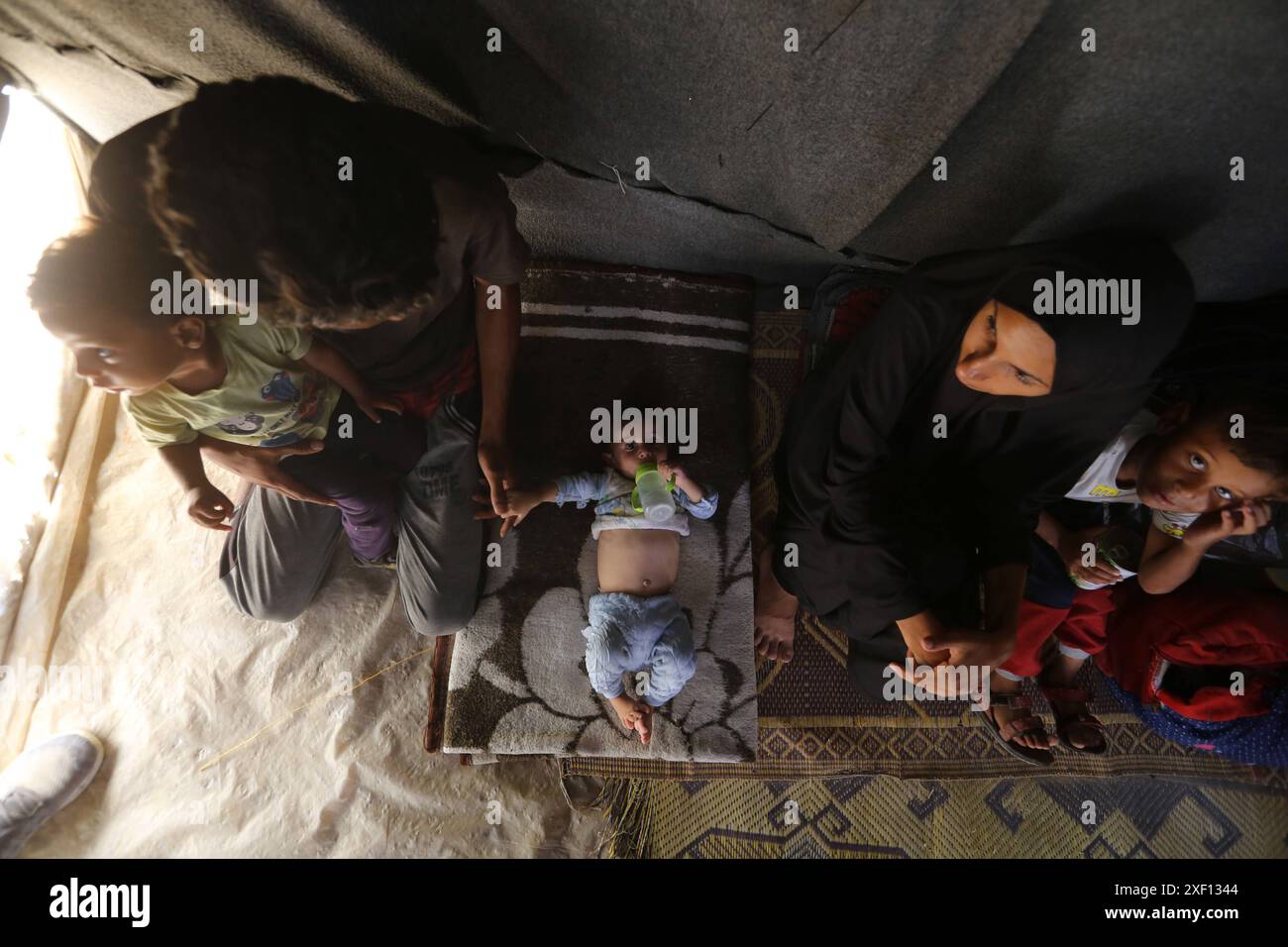 Noura Abu Al-Saud, a displaced Palestinian, lives in a tent inside a ...