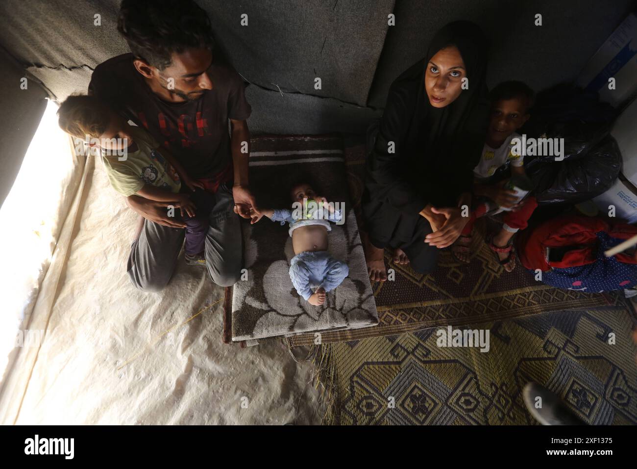 Noura Abu Al-Saud, a displaced Palestinian, lives in a tent inside a ...