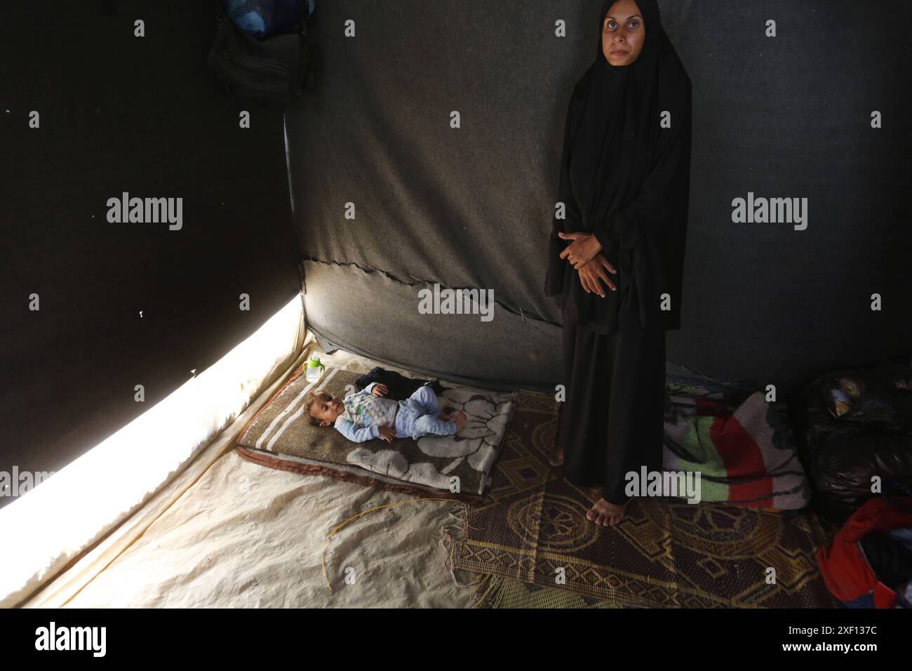 Noura Abu Al-Saud, a displaced Palestinian, lives in a tent inside a ...