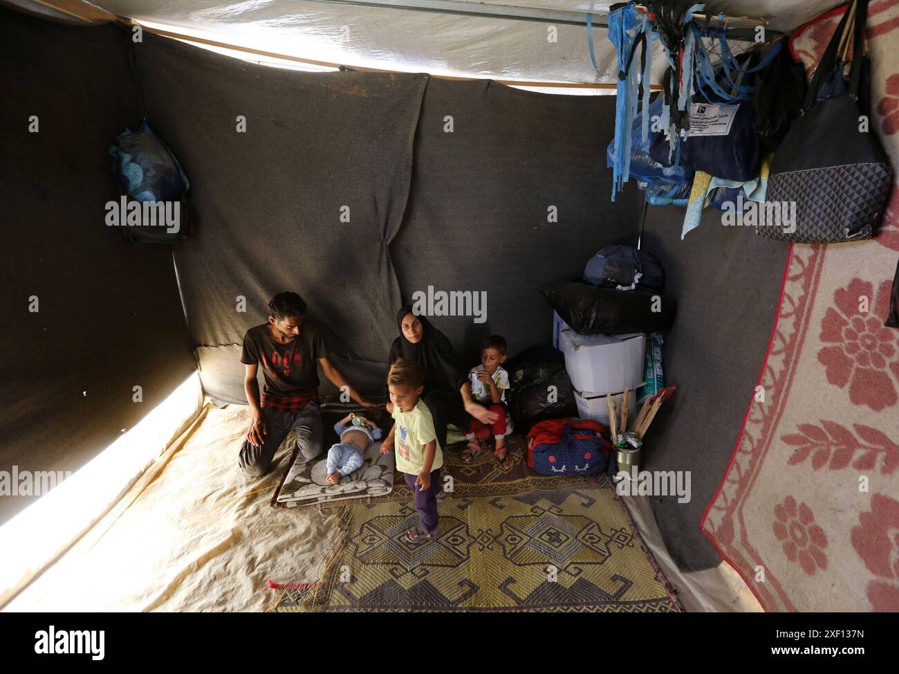 Noura Abu Al-Saud, a displaced Palestinian, lives in a tent inside a ...