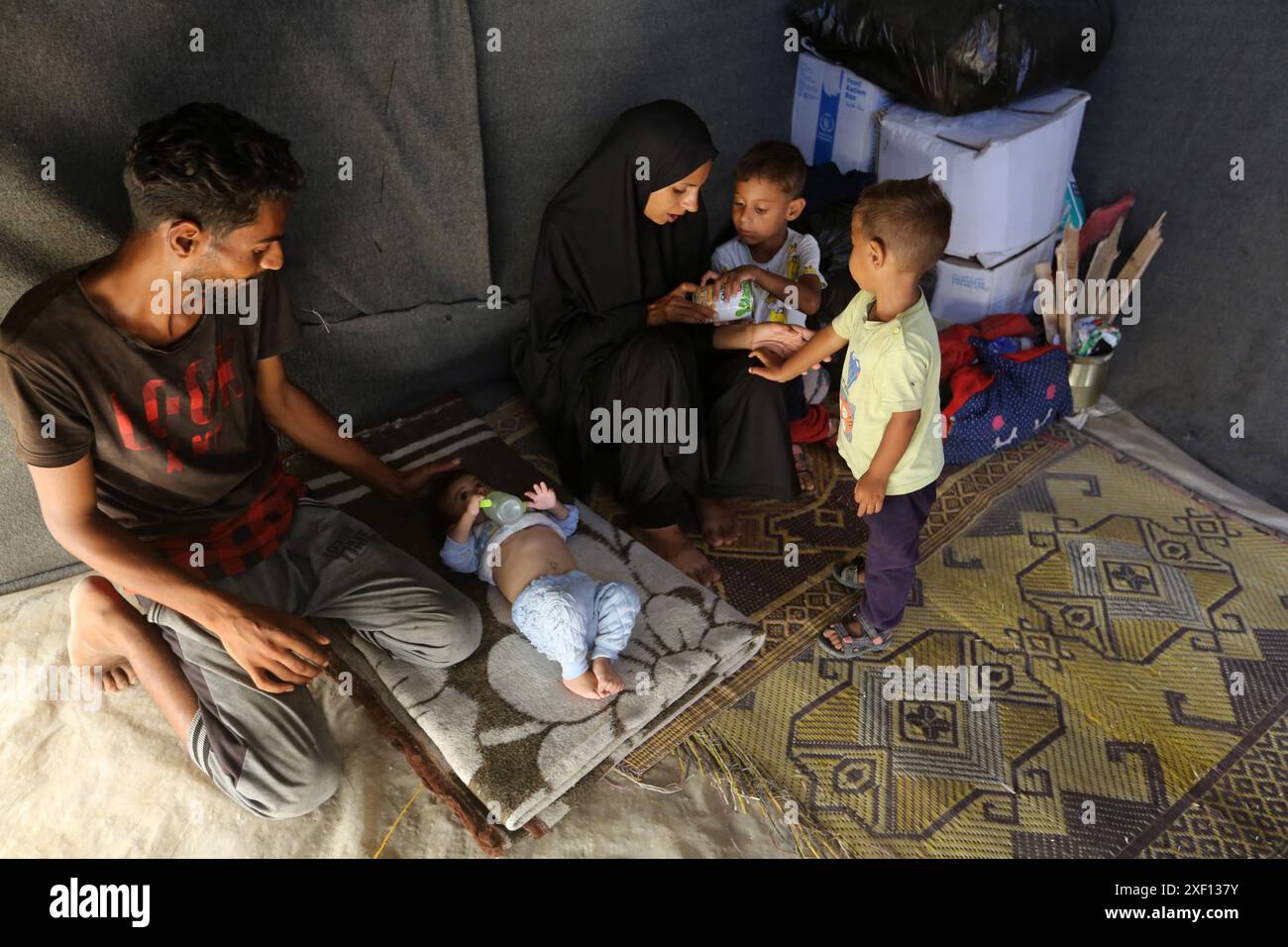 Noura Abu Al-Saud, a displaced Palestinian, lives in a tent inside a ...