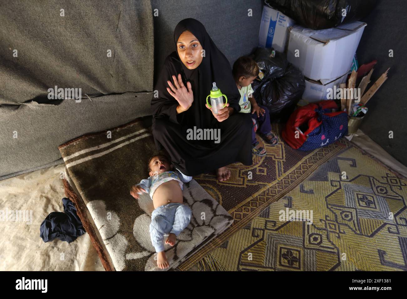 Noura Abu Al-Saud, a displaced Palestinian, lives in a tent inside a ...