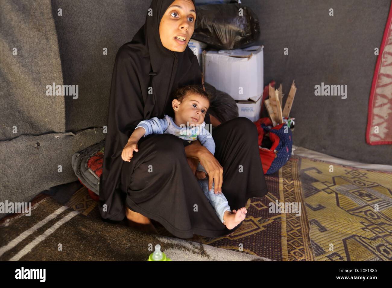 Noura Abu Al-Saud, a displaced Palestinian, lives in a tent inside a ...