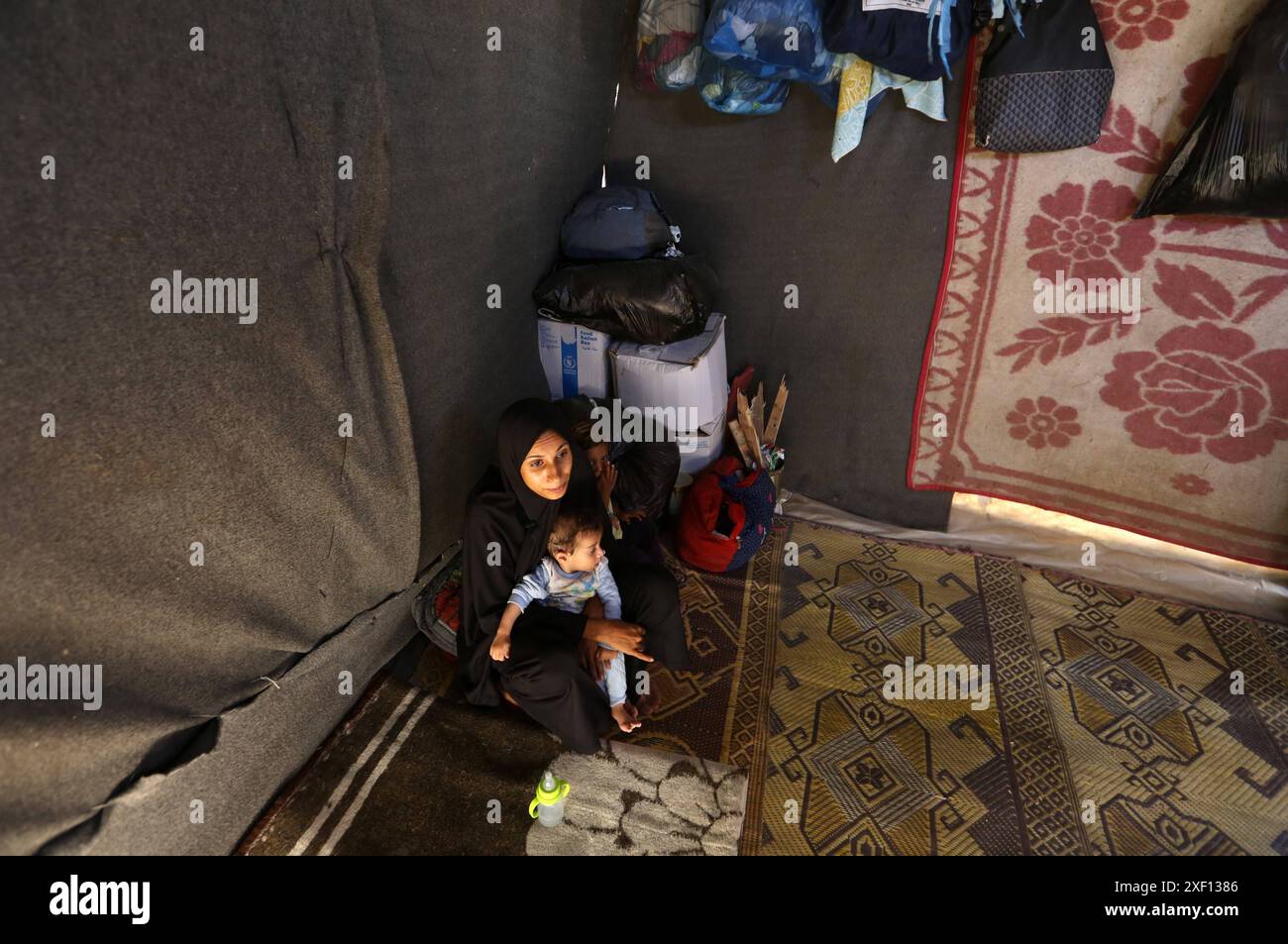 Noura Abu Al-Saud, a displaced Palestinian, lives in a tent inside a ...