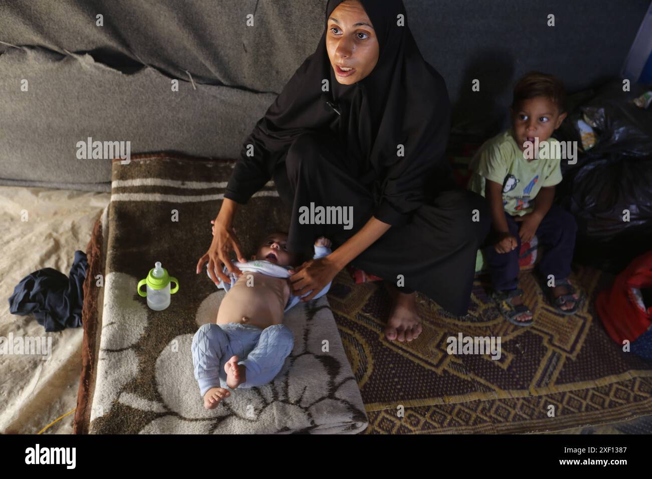 Noura Abu Al-Saud, a displaced Palestinian, lives in a tent inside a ...